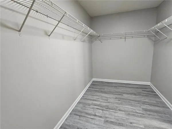 a kitchen with granite countertop cabinets and steel stainless steel appliances