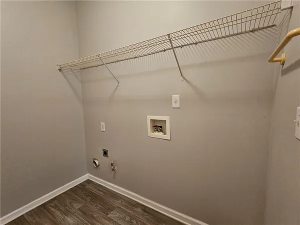 a bedroom with a bed and a chair