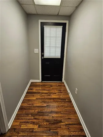 a view of a backyard with plants and a patio