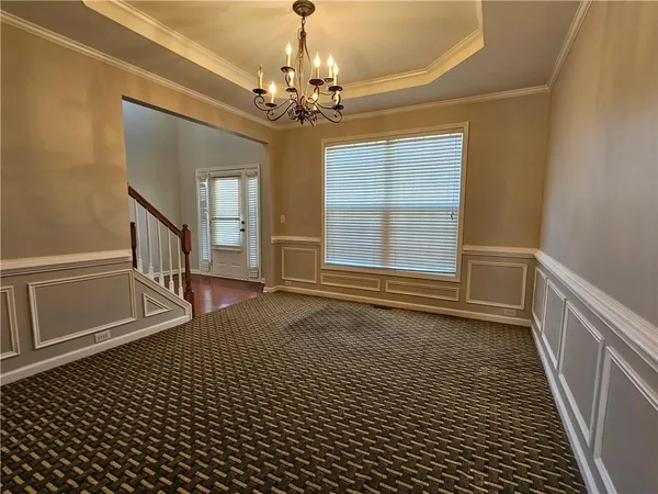 a view of an entryway with wooden floor and stairs