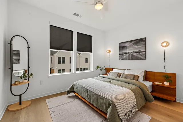 a bedroom with bed and window