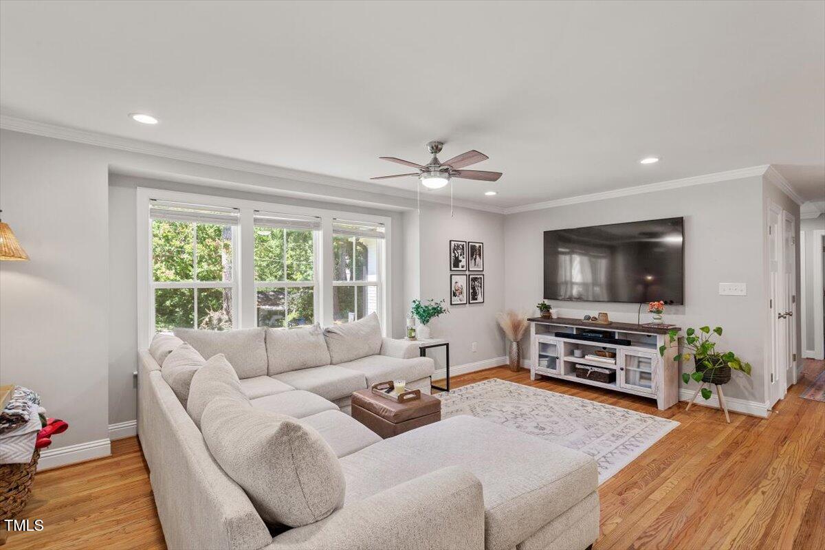 2222 Watkins Street Raleigh, NC 27604 - Photo 2 of 17 a living room with furniture and a flat screen tv
