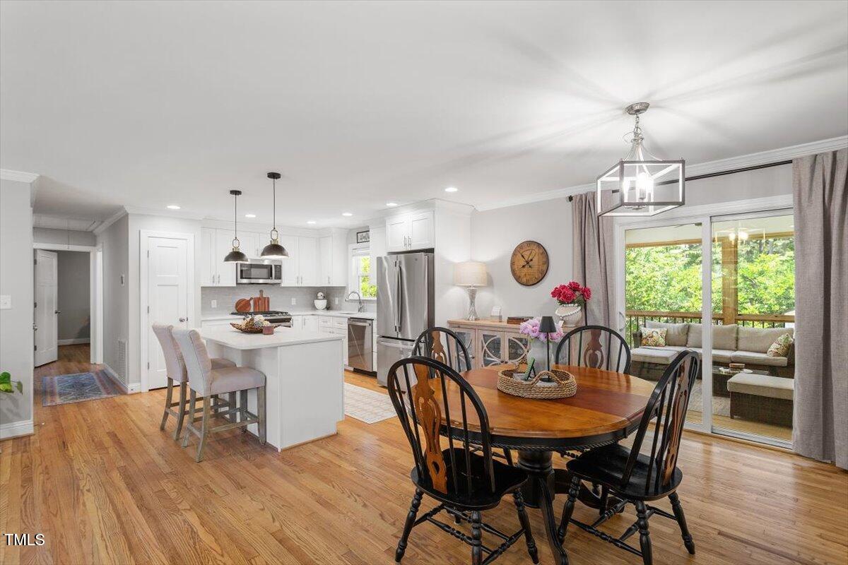 2222 Watkins Street Raleigh, NC 27604 - Photo 3 of 17 a view of a dining room with furniture window and wooden floor
