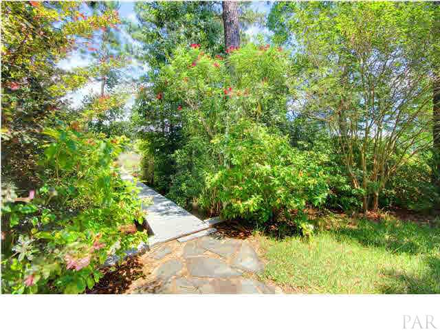 554 Riola Place Pensacola, FL 32506 - Photo 7 of 20 Tree lined boardwalk to boat house and canal