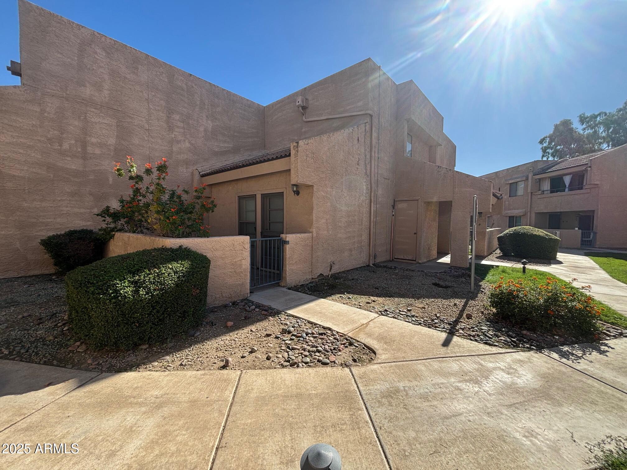10828 North Biltmore Drive, Unit 154 Phoenix, AZ 85029 - Photo 2 of 23 a house view with a backyard space