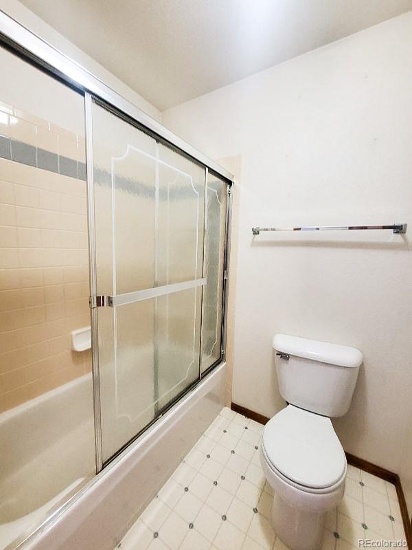 4934 South Danube Street Aurora, CO 80015 - Photo 16 of 22 a bathroom with a toilet and a shower