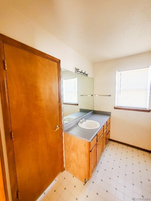 4934 South Danube Street Aurora, CO 80015 - Photo 17 of 22 a kitchen that has a sink in it