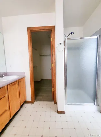a view of a bathroom with a sink and a mirror
