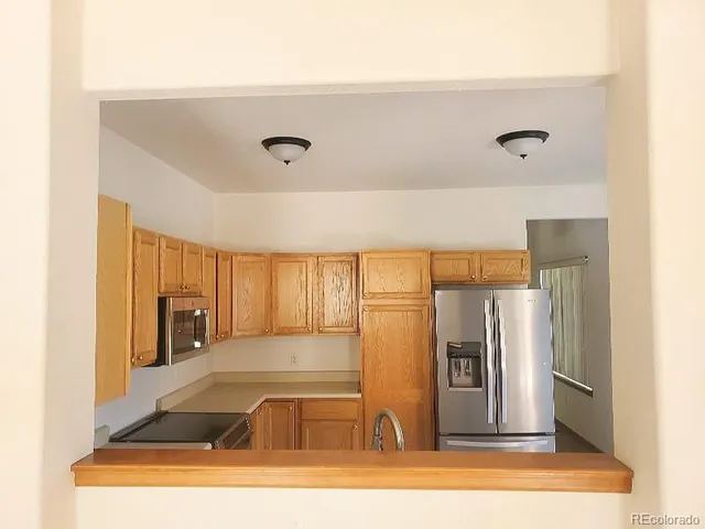 a view of a kitchen with a sink