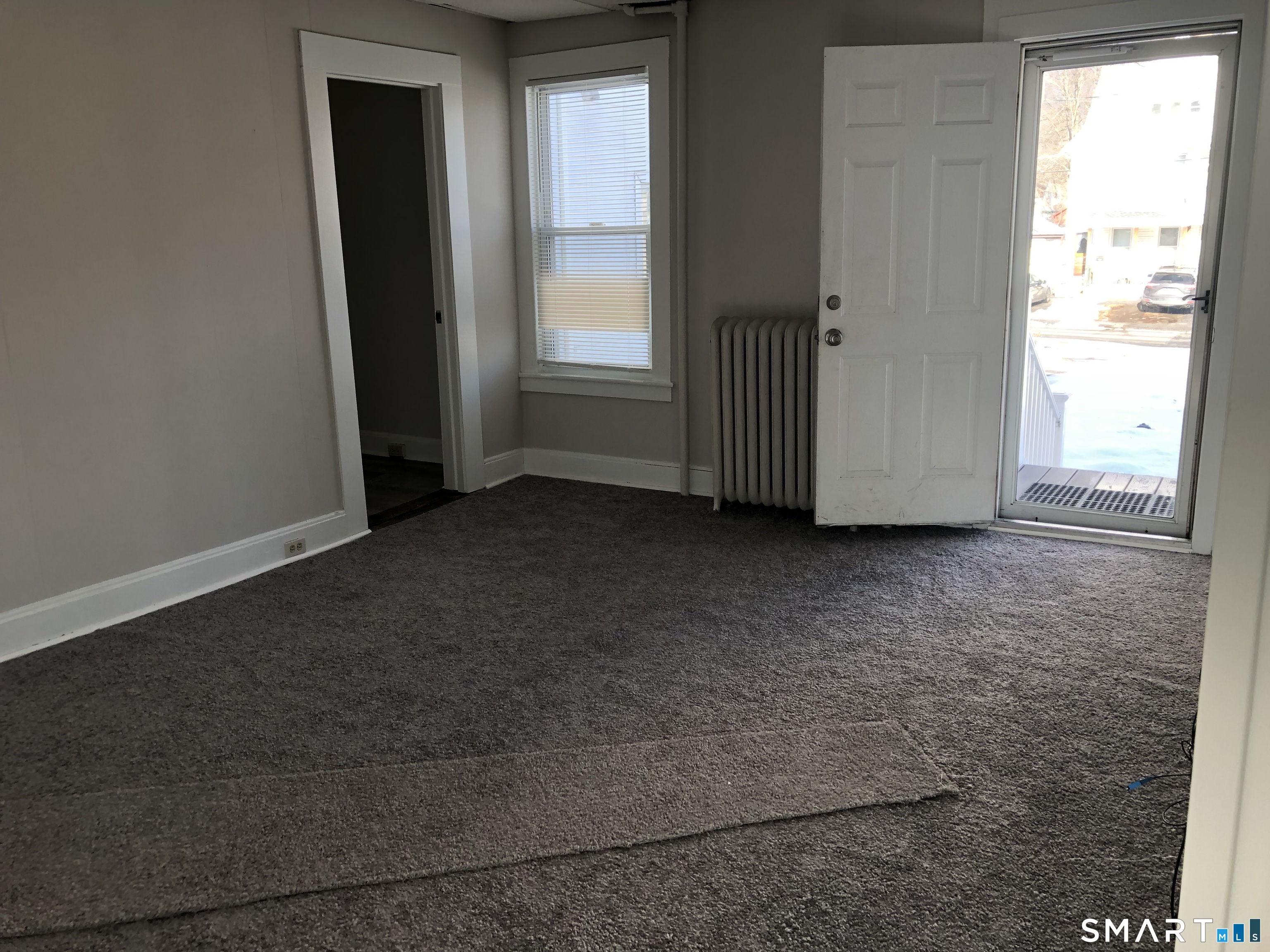 23 Taylor Street Torrington, CT 06790 - Photo 3 of 16 an empty room with windows