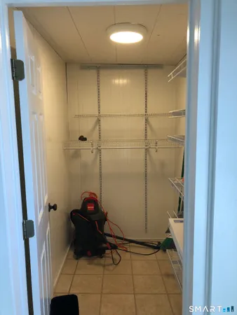 a bathroom with a mirror and shower