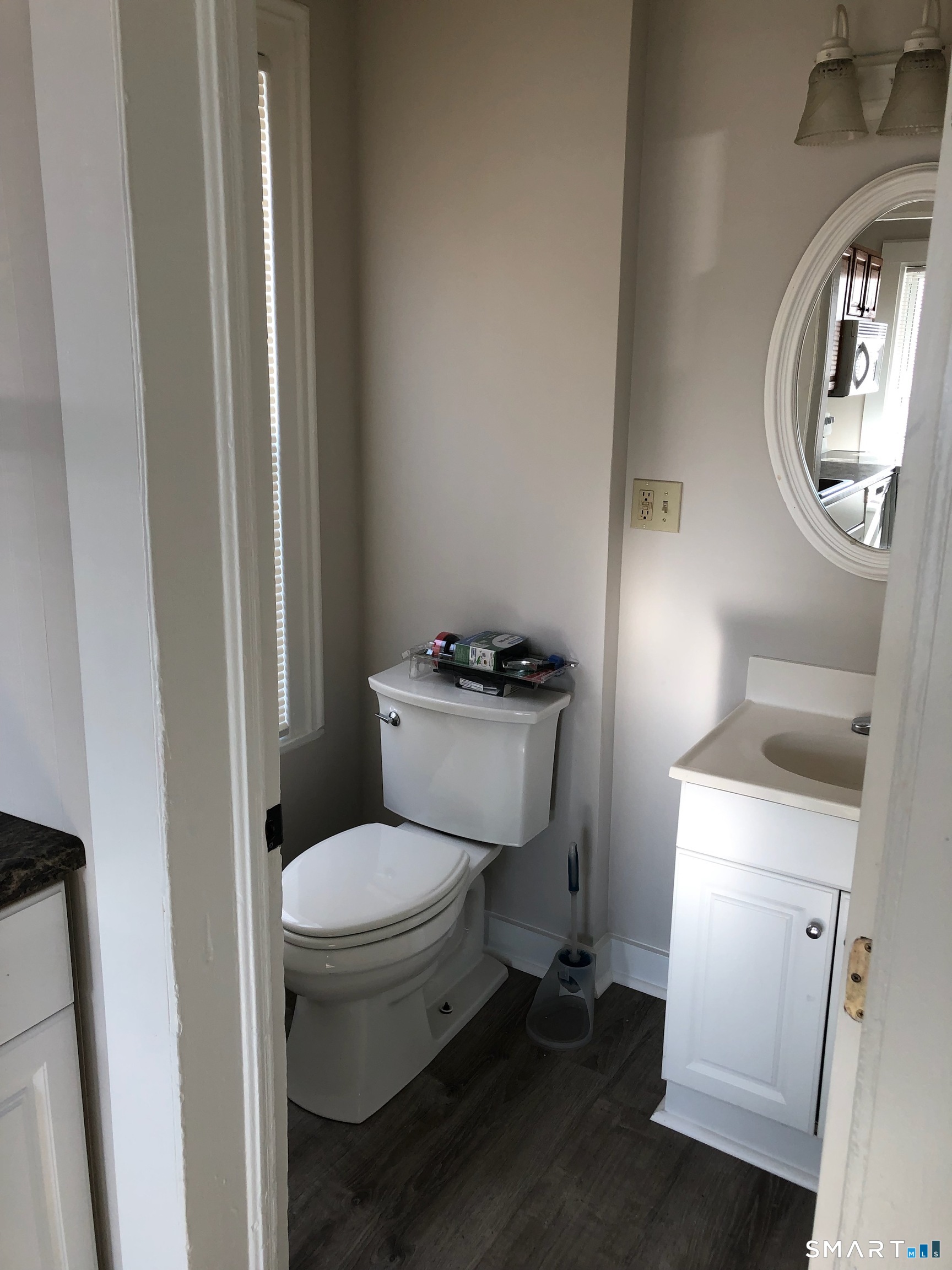 23 Taylor Street Torrington, CT 06790 - Photo 7 of 16 a white toilet sitting next to a bathroom sink