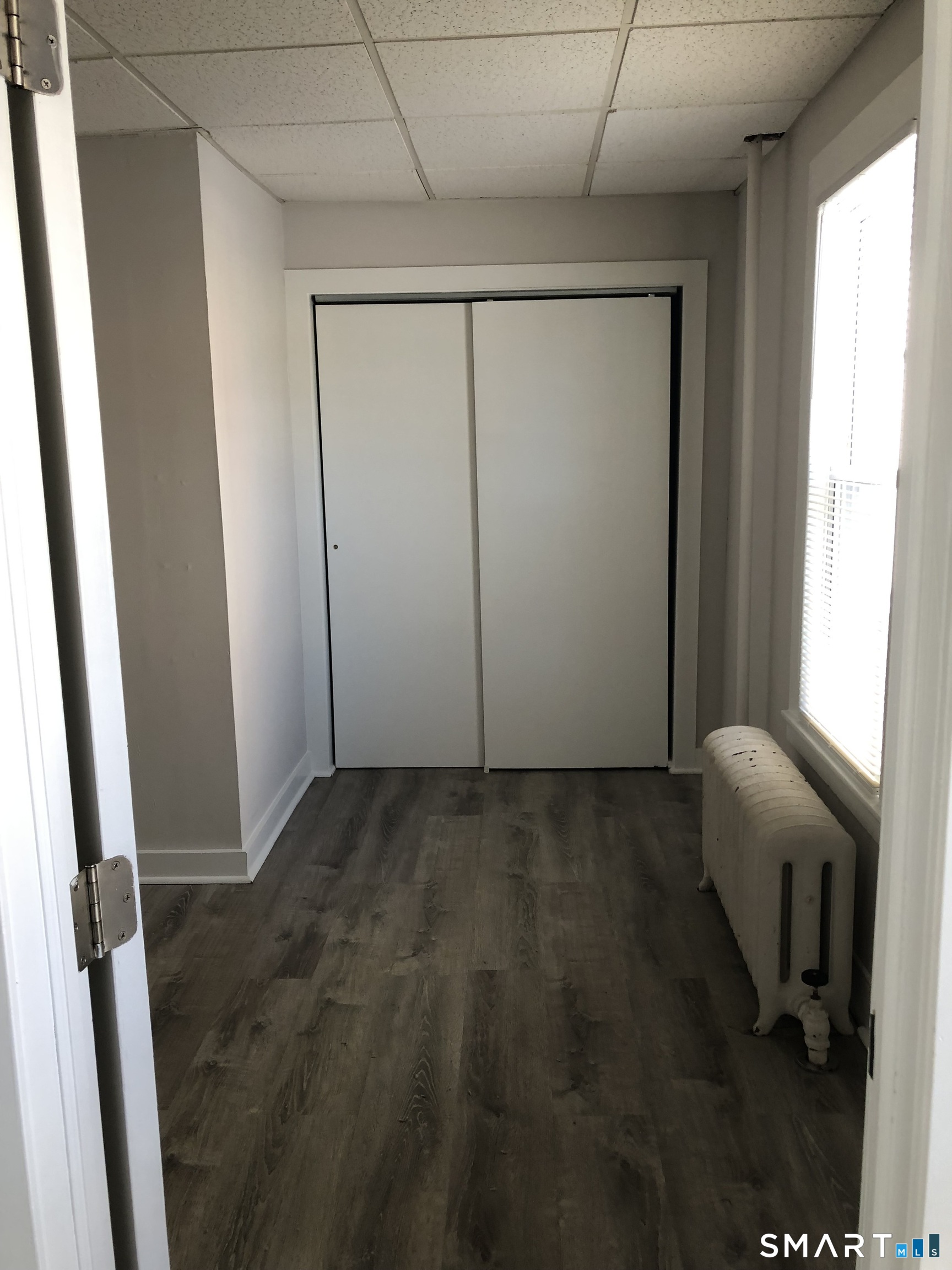 23 Taylor Street Torrington, CT 06790 - Photo 8 of 16 a view of a room with a wooden door and chair