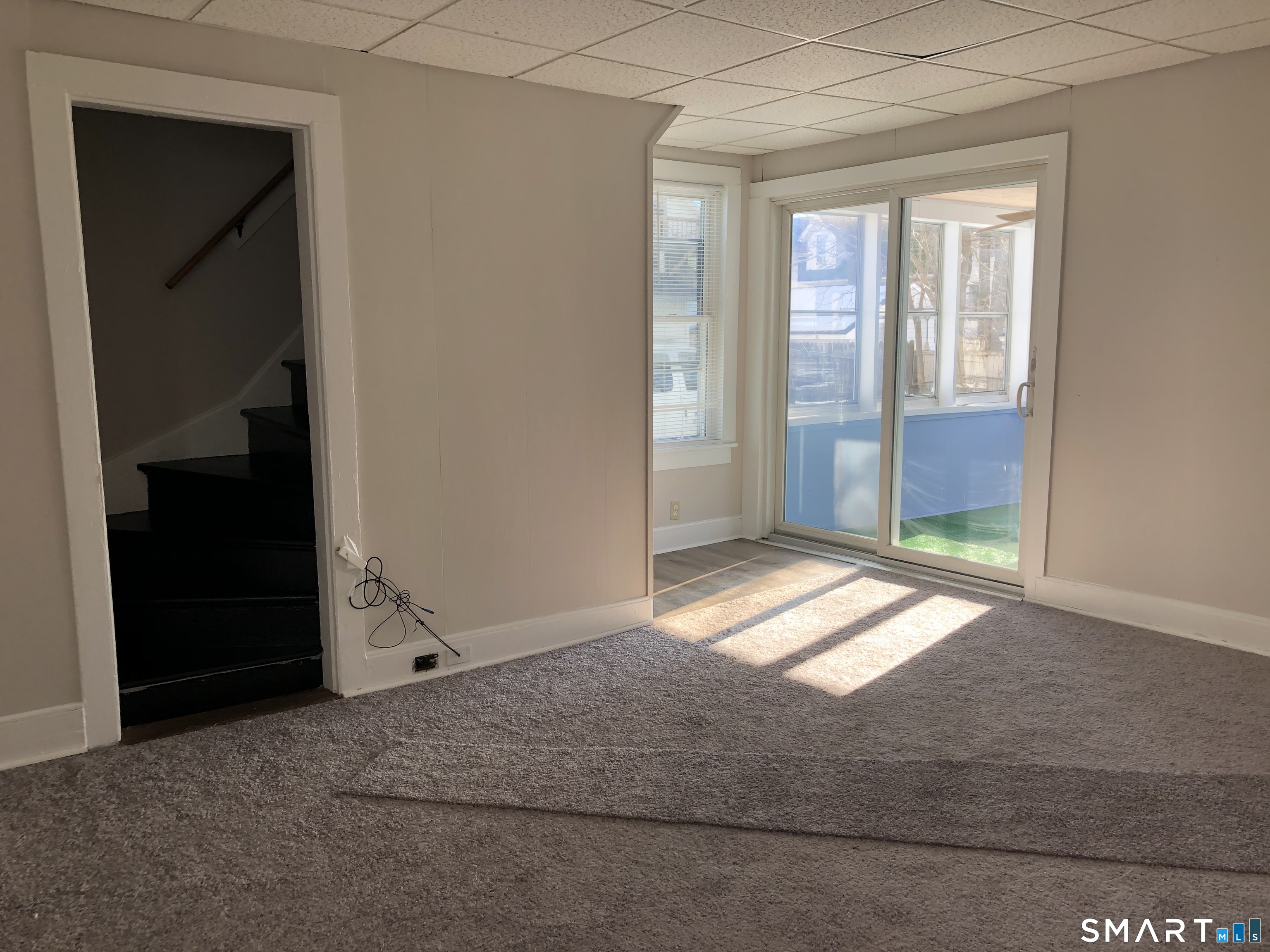 23 Taylor Street Torrington, CT 06790 - Photo 9 of 16 an empty room with windows