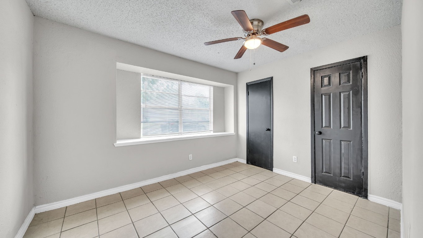 10902 Jutland Road Houston, TX 77048 - Photo 14 of 20 a view of an empty room with a window