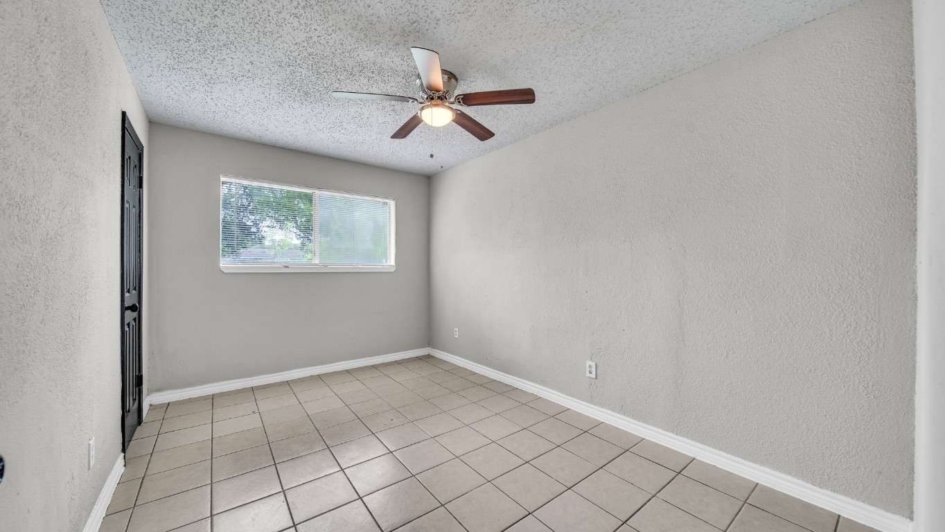 10902 Jutland Road Houston, TX 77048 - Photo 15 of 20 a view of an empty room with a window