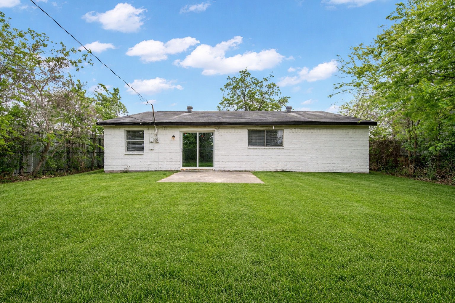 10902 Jutland Road Houston, TX 77048 - Photo 17 of 20 a front view of house with yard and trees