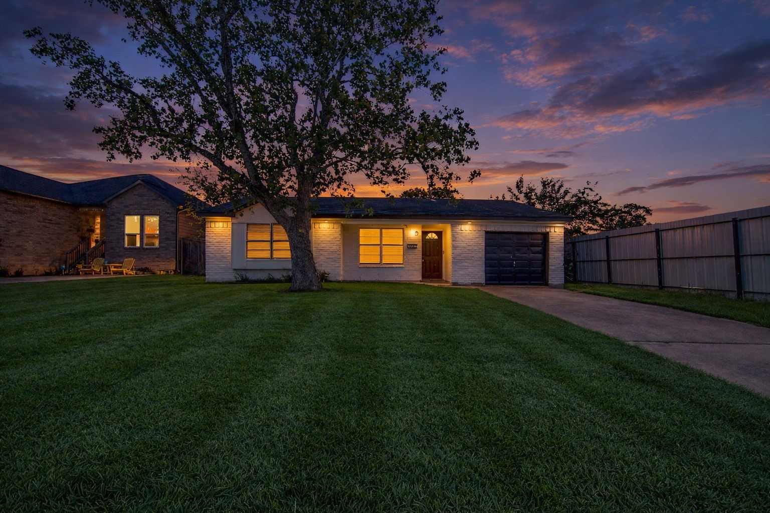10902 Jutland Road Houston, TX 77048 - Photo 18 of 20 a front view of a house with a garden