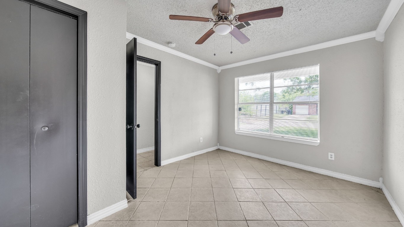 10902 Jutland Road Houston, TX 77048 - Photo 4 of 20 a view of an empty room with a window