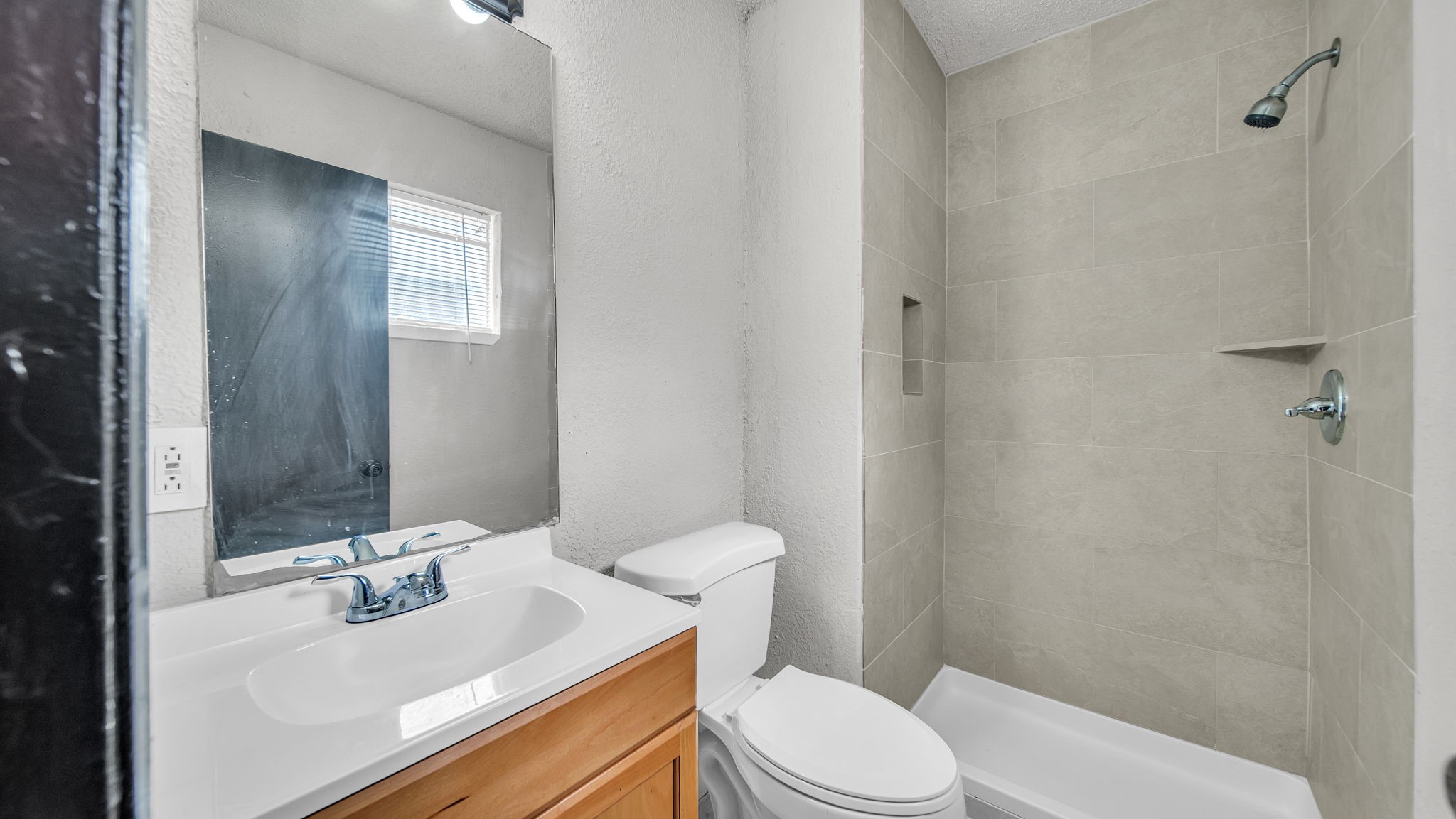 10902 Jutland Road Houston, TX 77048 - Photo 6 of 20 a bathroom with a sink a toilet and shower