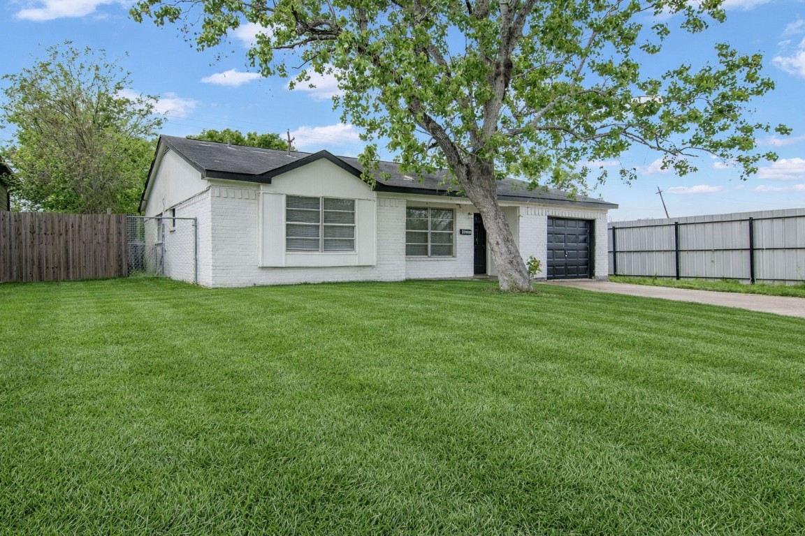 10902 Jutland Road Houston, TX 77048 - Photo 7 of 20 a house with a tree in front of it