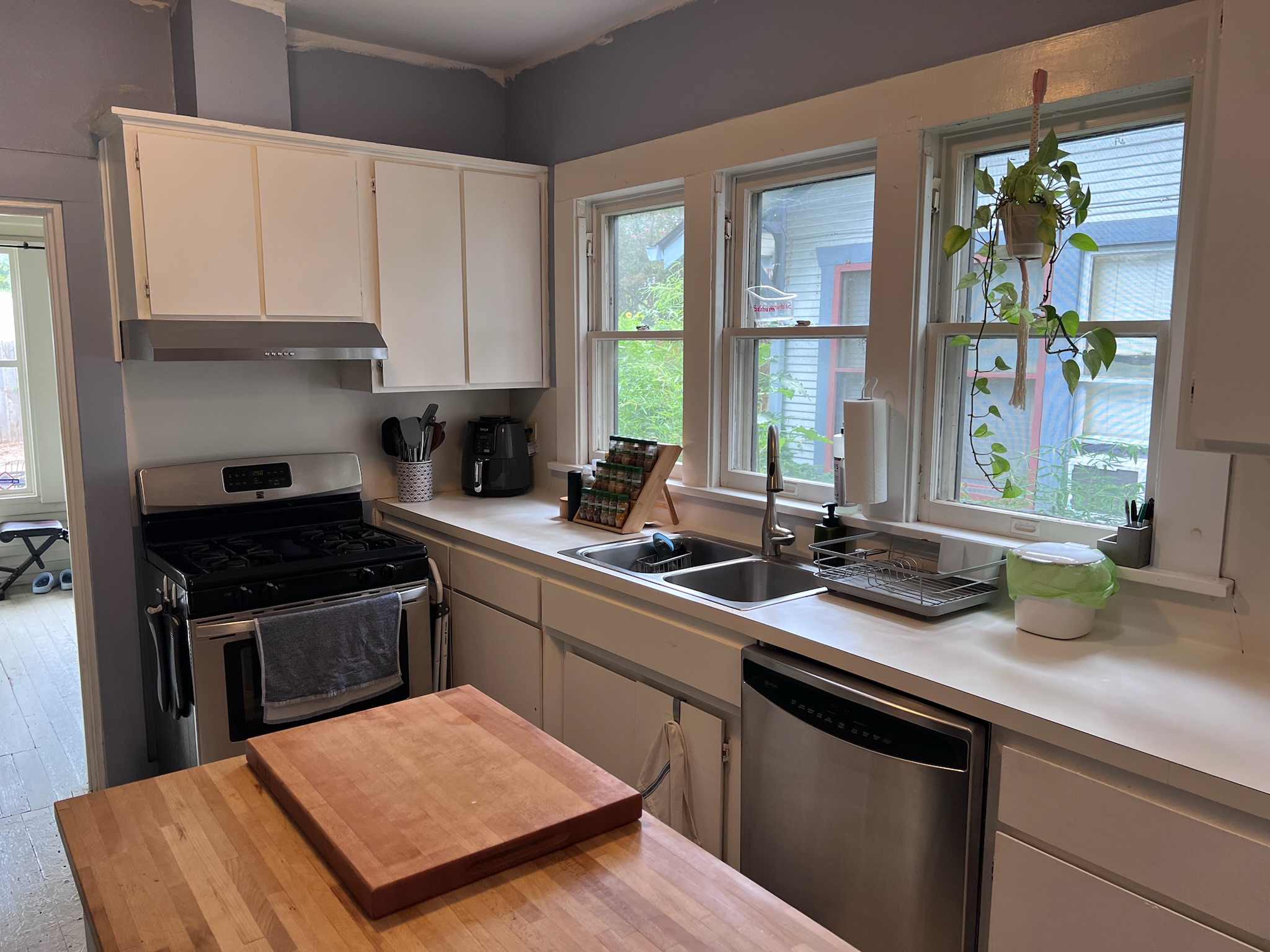 307 East 35th Street, Unit A Austin, TX 78705 - Photo 12 of 31 A well-equipped kitchen space featuring a gas range and bright windows.