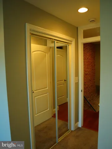 a bathroom with a glass door shower and a sink