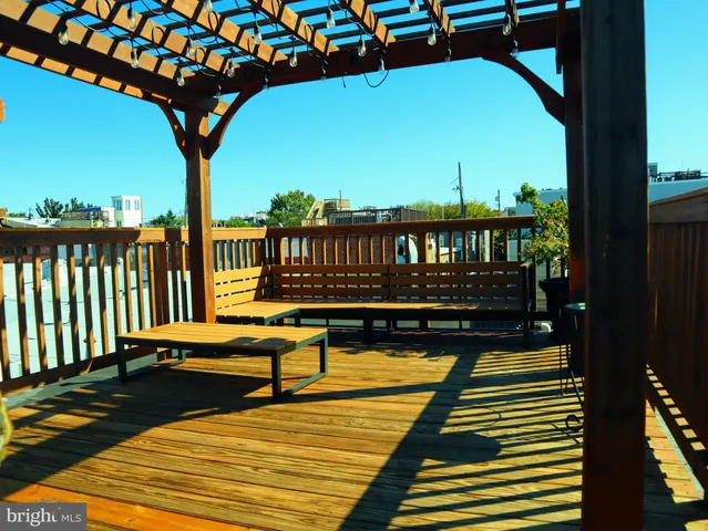 a view of swimming pool with seating area