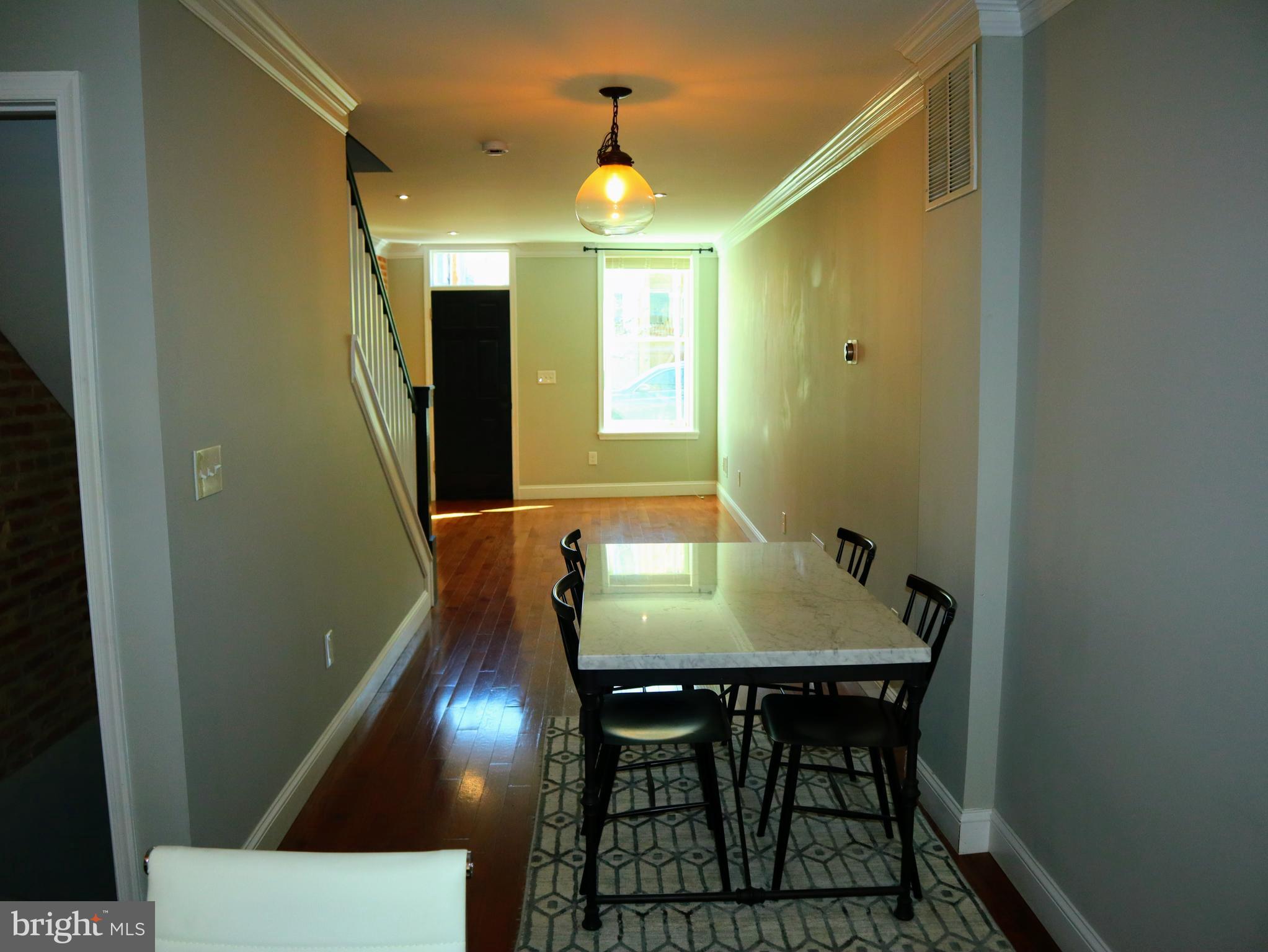 926 South Curley Street Baltimore, MD 21224 - Photo 5 of 25 a view of a livingroom with furniture and window