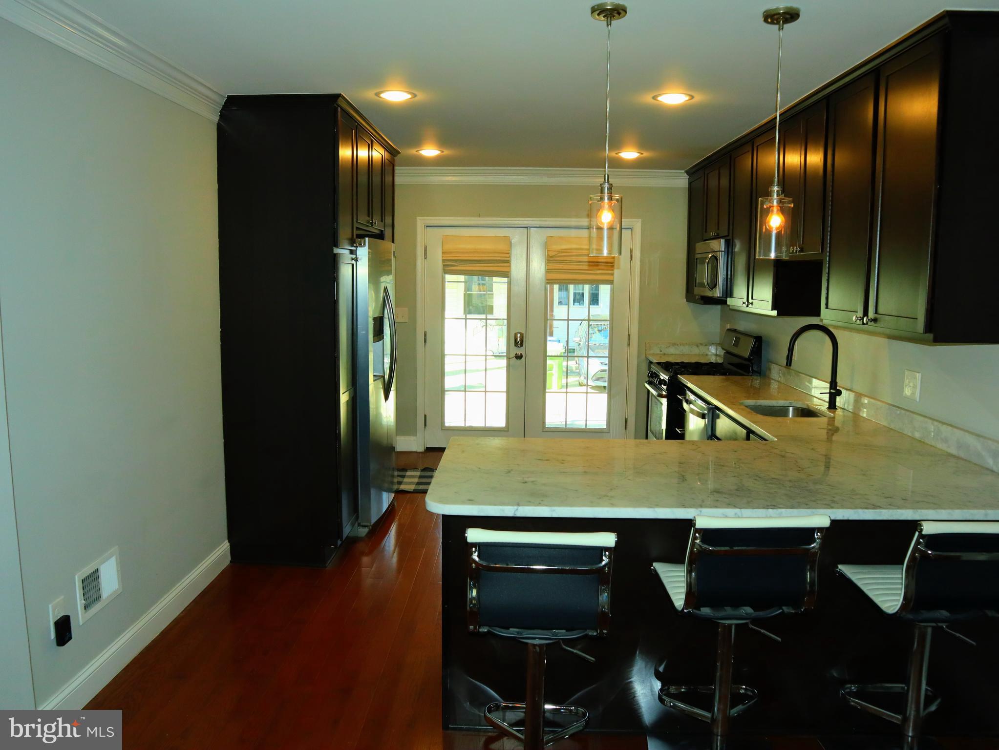 926 South Curley Street Baltimore, MD 21224 - Photo 6 of 25 a view of a dining room with furniture