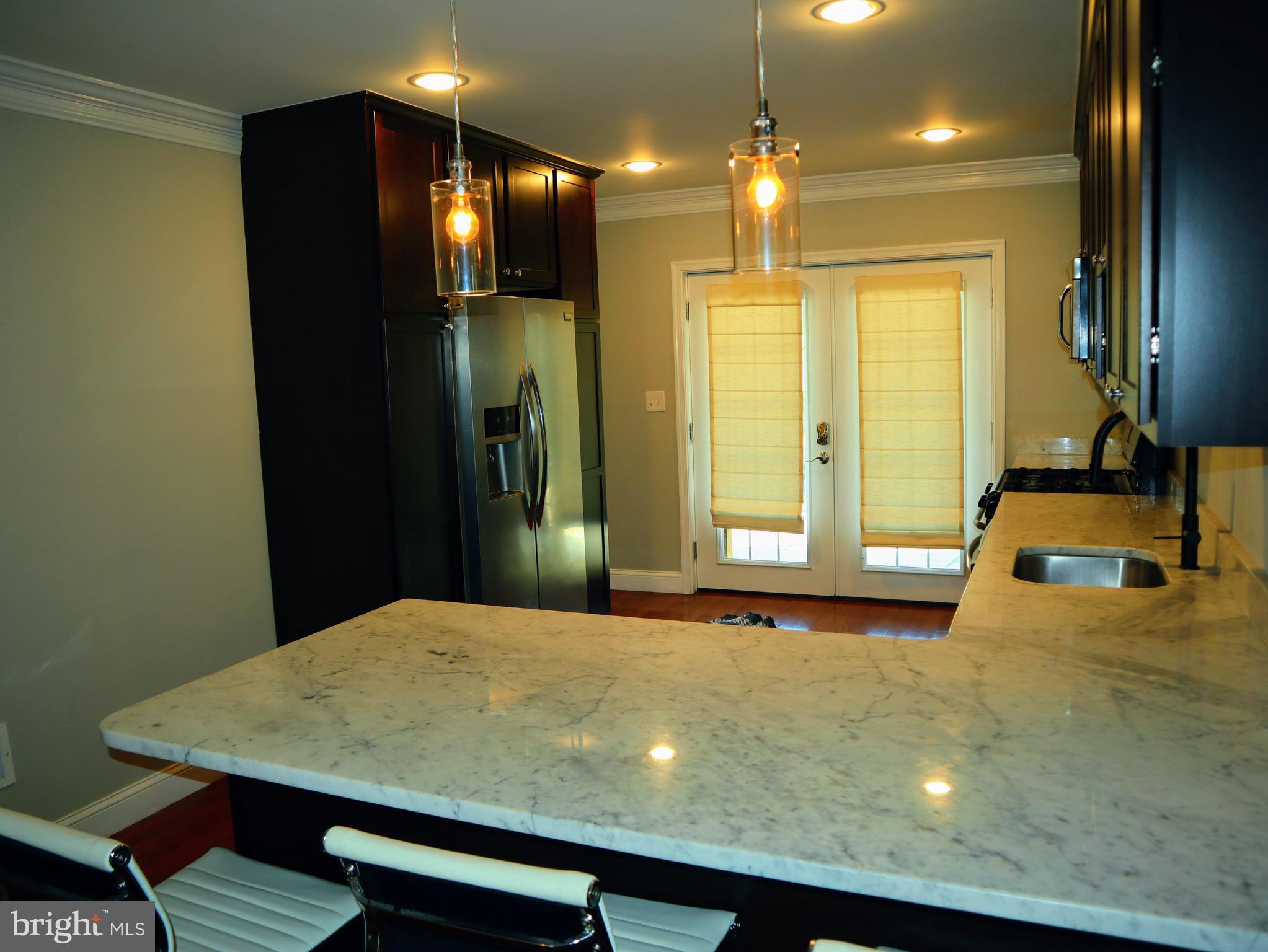 926 South Curley Street Baltimore, MD 21224 - Photo 10 of 25 a bathroom with a sink and a mirror