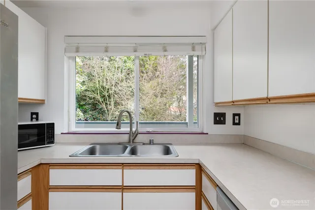 a kitchen with a sink and a window