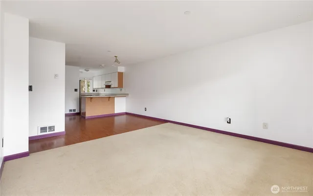 a kitchen with stainless steel appliances a refrigerator and a stove top oven
