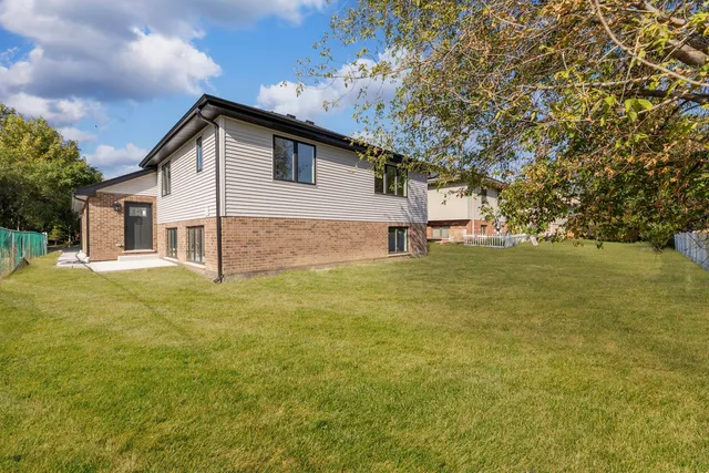 a house view with swimming pool in front of it