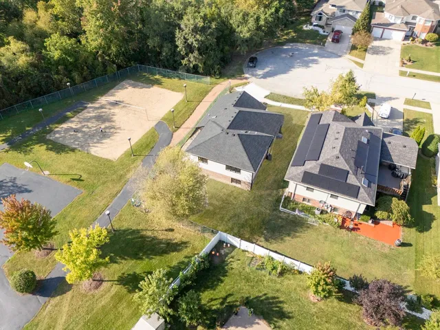 an aerial view of residential houses with outdoor space