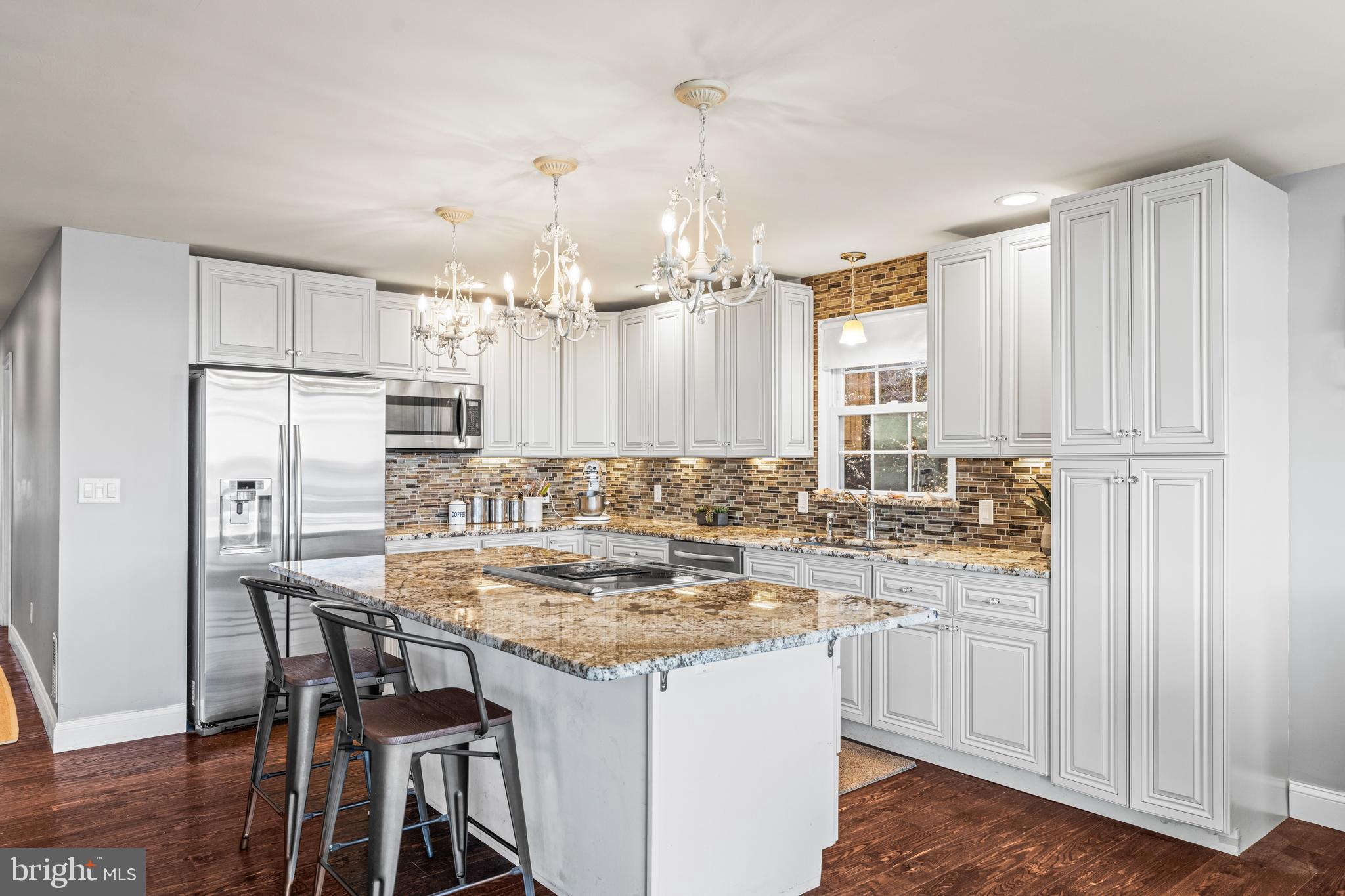 3930 Glenhurst Road Baltimore, MD 21222 - Photo 11 of 29 a kitchen with kitchen island a sink stove and refrigerator