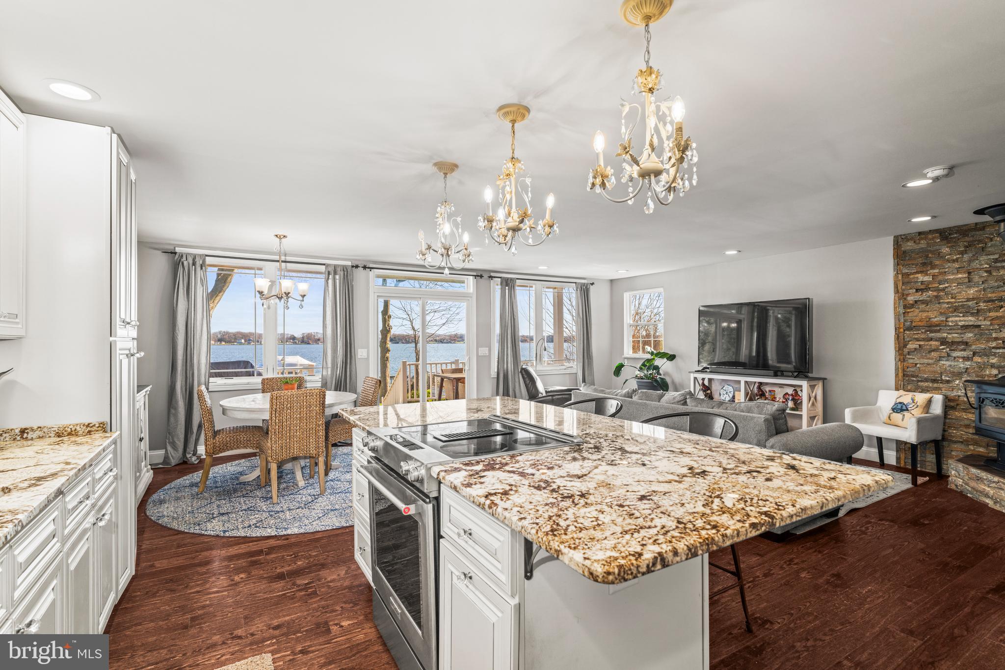 3930 Glenhurst Road Baltimore, MD 21222 - Photo 29 of 29 a view of a kitchen and dining table a chandelier