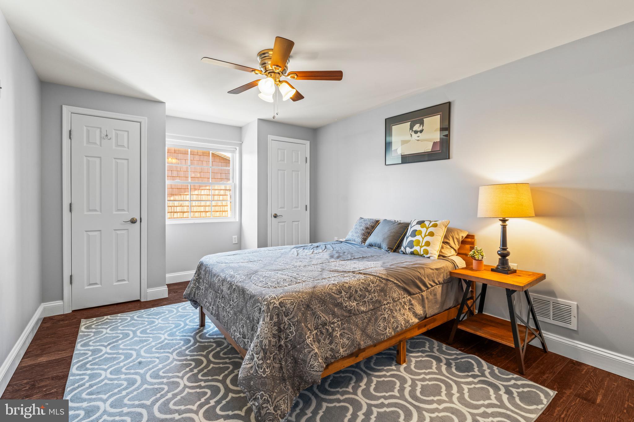 3930 Glenhurst Road Baltimore, MD 21222 - Photo 16 of 29 a bedroom with a bed and a lamp