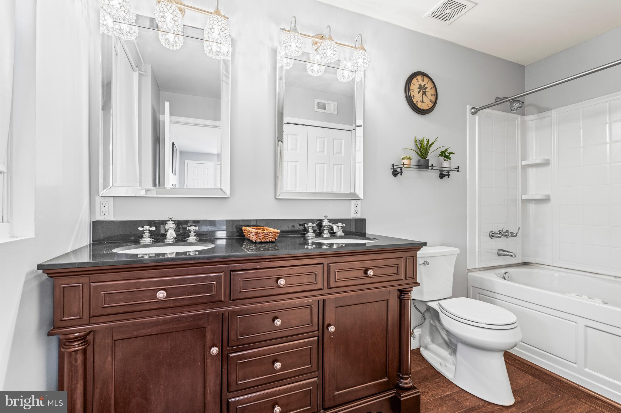 3930 Glenhurst Road Baltimore, MD 21222 - Photo 17 of 29 a bathroom with a toilet a sink and a mirror
