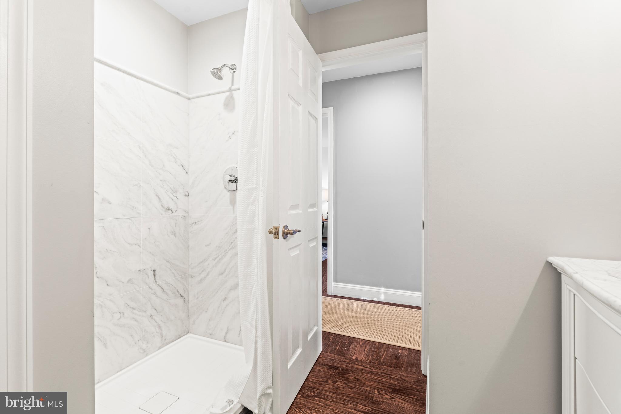 3930 Glenhurst Road Baltimore, MD 21222 - Photo 19 of 29 a bathroom with a shower