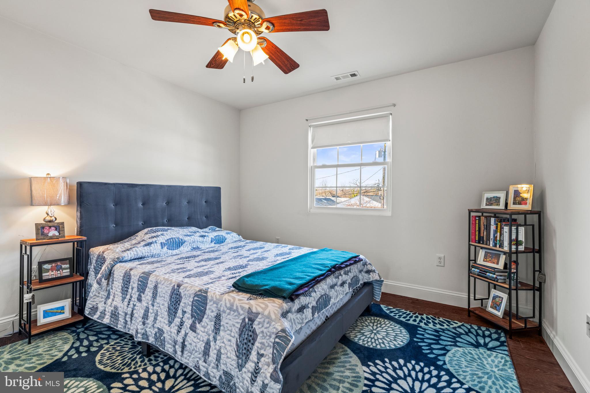 3930 Glenhurst Road Baltimore, MD 21222 - Photo 23 of 29 a bed sitting in a bedroom next to a window