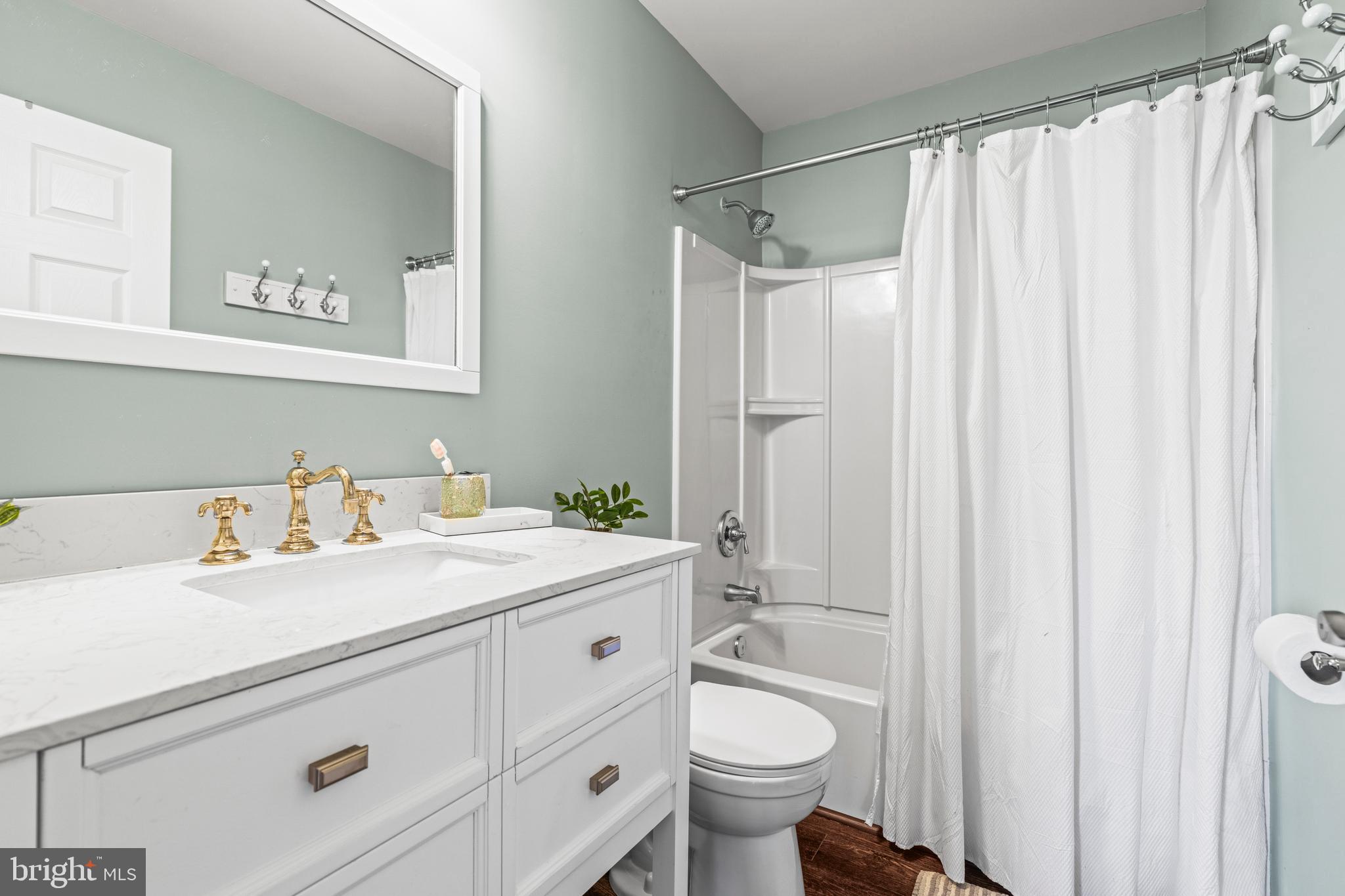 3930 Glenhurst Road Baltimore, MD 21222 - Photo 24 of 29 a bathroom with a sink a toilet and shower