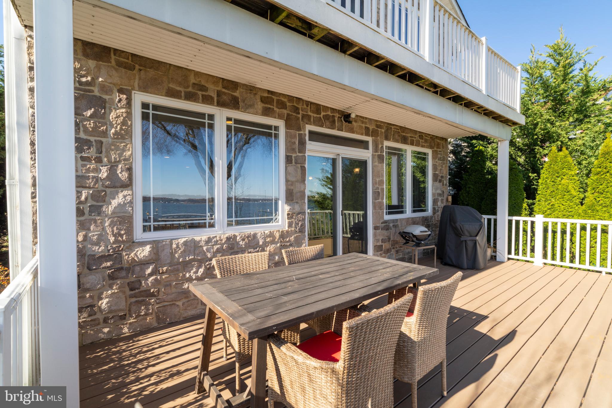 3930 Glenhurst Road Baltimore, MD 21222 - Photo 26 of 29 a view of a patio with a table and chairs