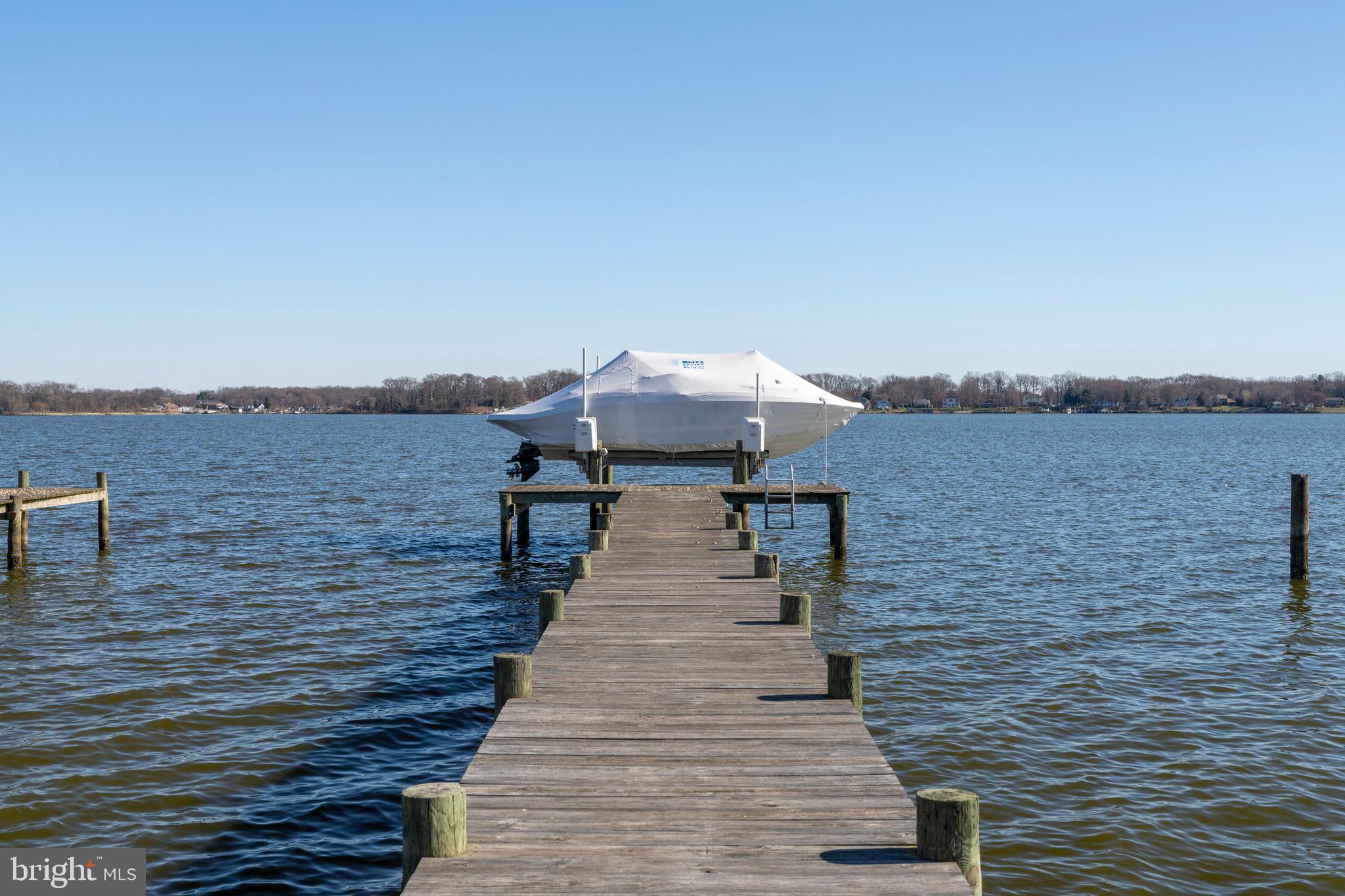 3930 Glenhurst Road Baltimore, MD 21222 - Photo 28 of 29 a view of house with wooden floor and lake view