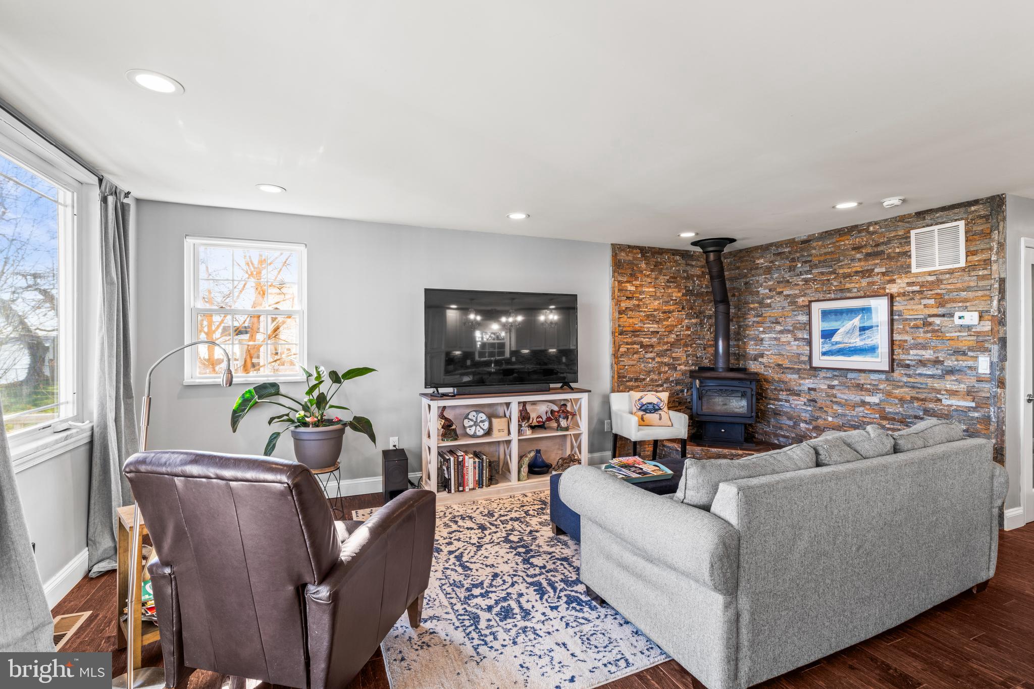 3930 Glenhurst Road Baltimore, MD 21222 - Photo 4 of 29 a living room with furniture and a flat screen tv