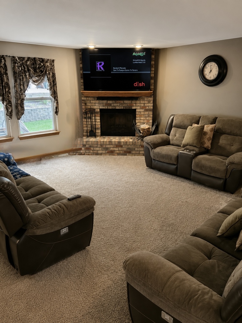 720 Ridge Drive Marengo, IL 60152 - Photo 5 of 34 a living room with furniture and a fireplace