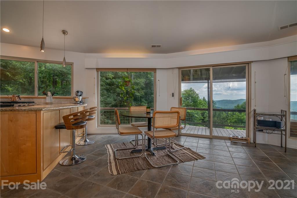 281 Big Rock Road Bostic, NC 28018 - Photo 14 of 48 a living room with furniture and a floor to ceiling window