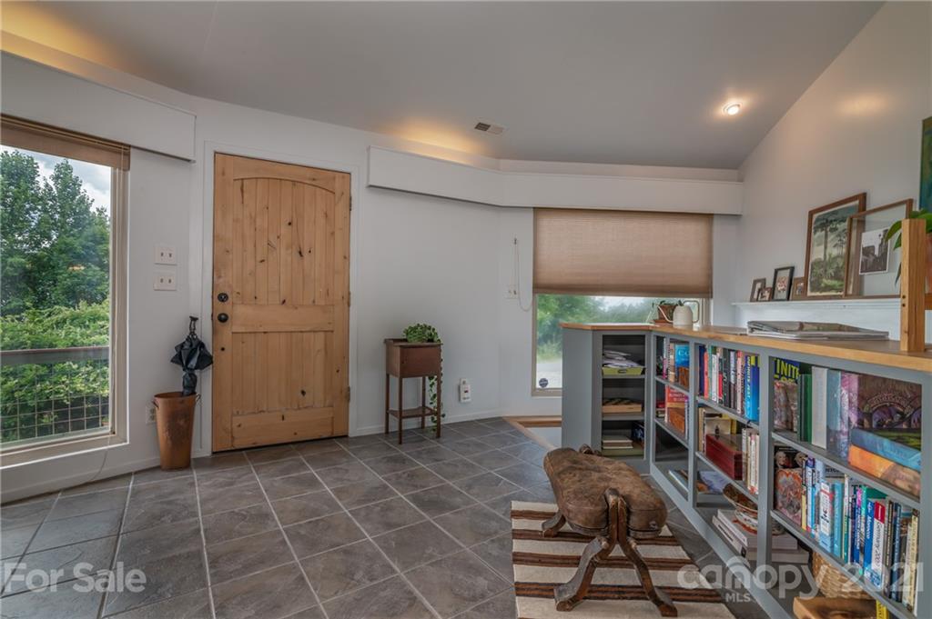 281 Big Rock Road Bostic, NC 28018 - Photo 18 of 48 a room with furniture a rug and a book shelf