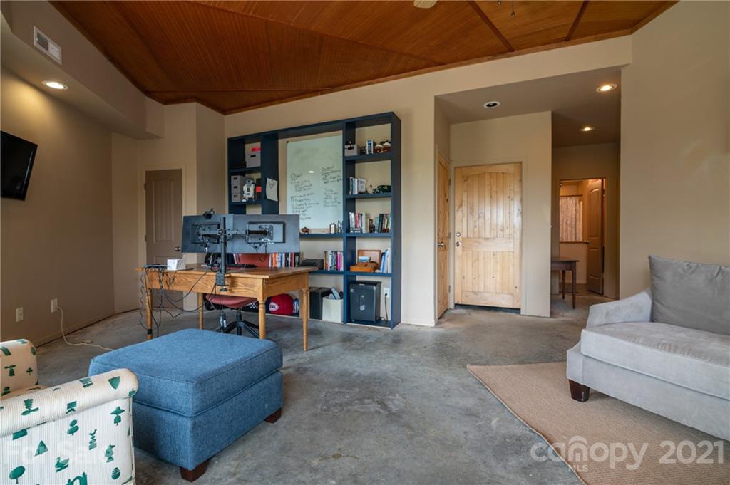 281 Big Rock Road Bostic, NC 28018 - Photo 23 of 48 a living room with furniture and a flat screen tv