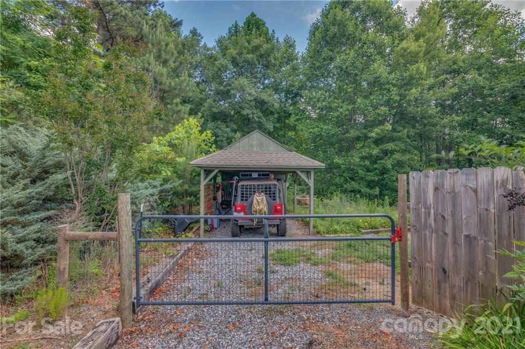 281 Big Rock Road Bostic, NC 28018 - Photo 31 of 48 a backyard of a house with barbeque oven